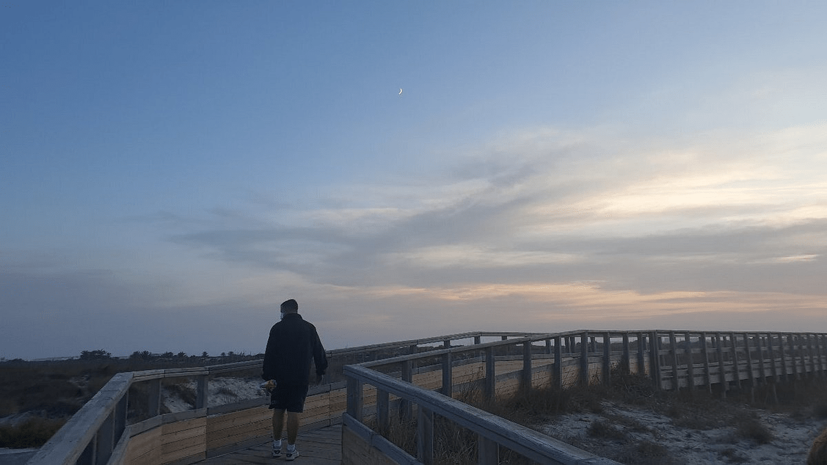 image from the wood path from playa de la torre derribada during sunset