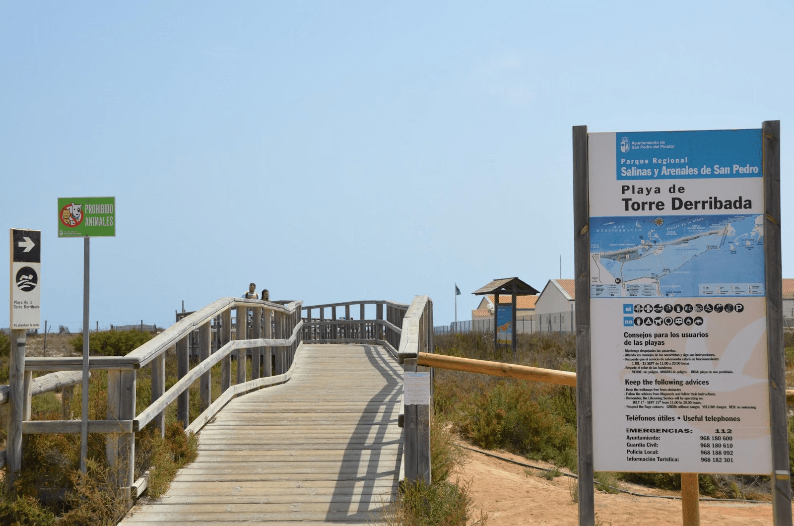 image showing the entrance for playa de la torre derribada along with multiple signs and rules