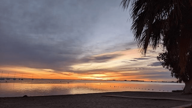 image showing the sea from playa de la torre derribada at sunset