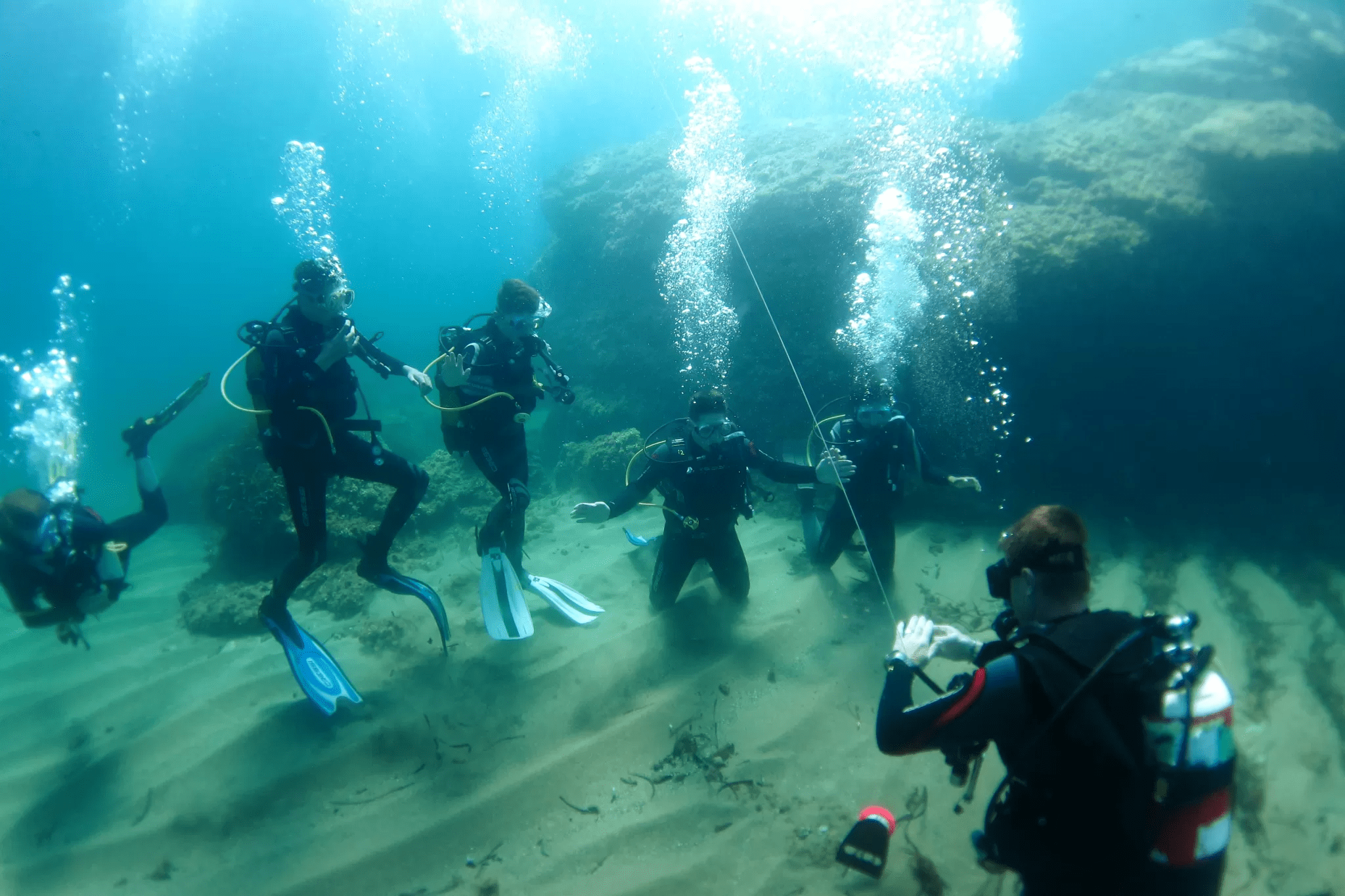 People being guided by experienced divers in the Hormigas Islands Marine Reserve, in Cabo de Palos