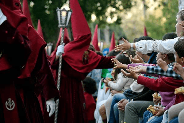 Brotherhood distributing candy to public