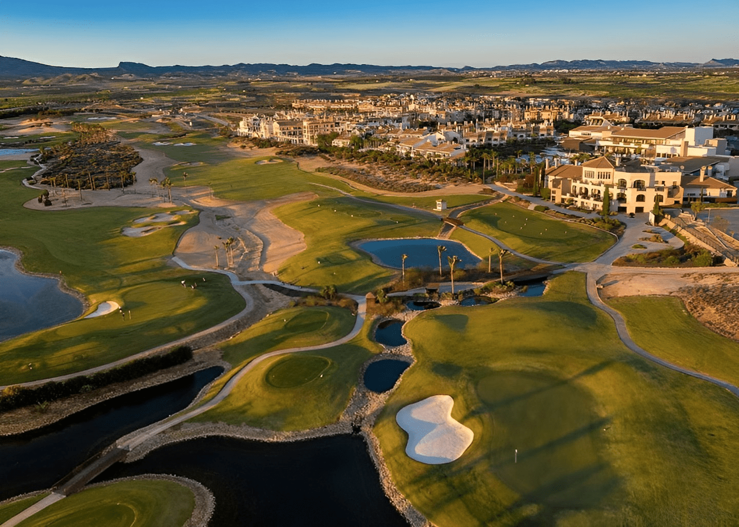 image from hacienda del alamo showing the golf fields with the city in the back