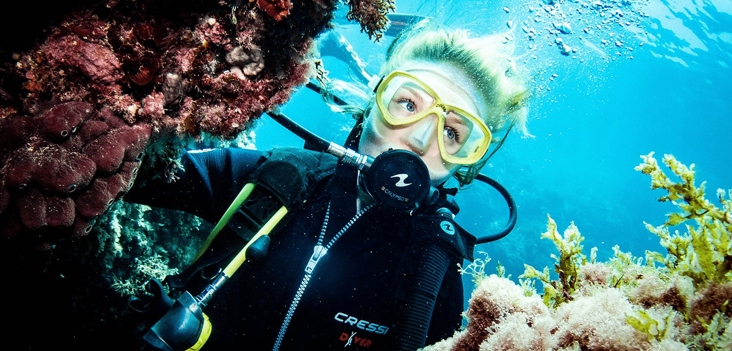 image of a woman scuba diving