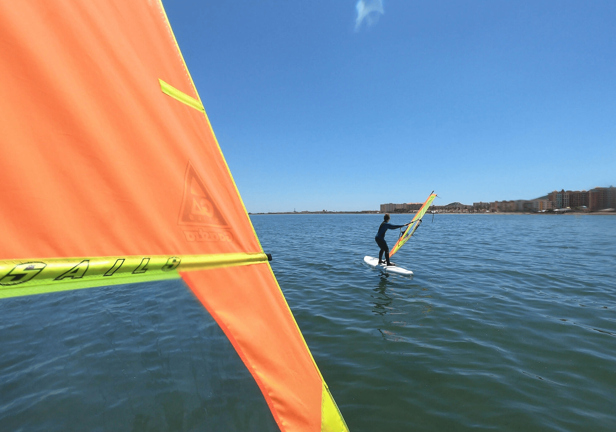 image of a person windsurfing at the beach