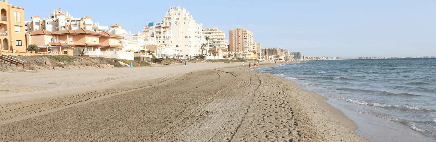 image of the sand showing the city on the background