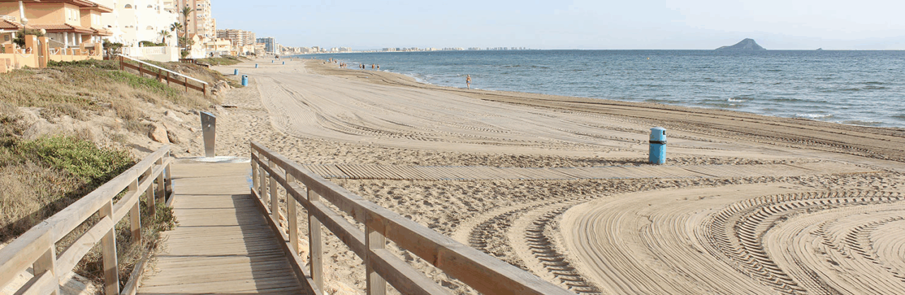 picture from playa del banco del tabal showing some of the wooden paths available at the shore