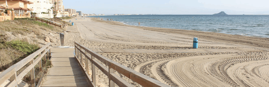 picture from playa del banco del tabal showing some of the wooden paths available at the shore