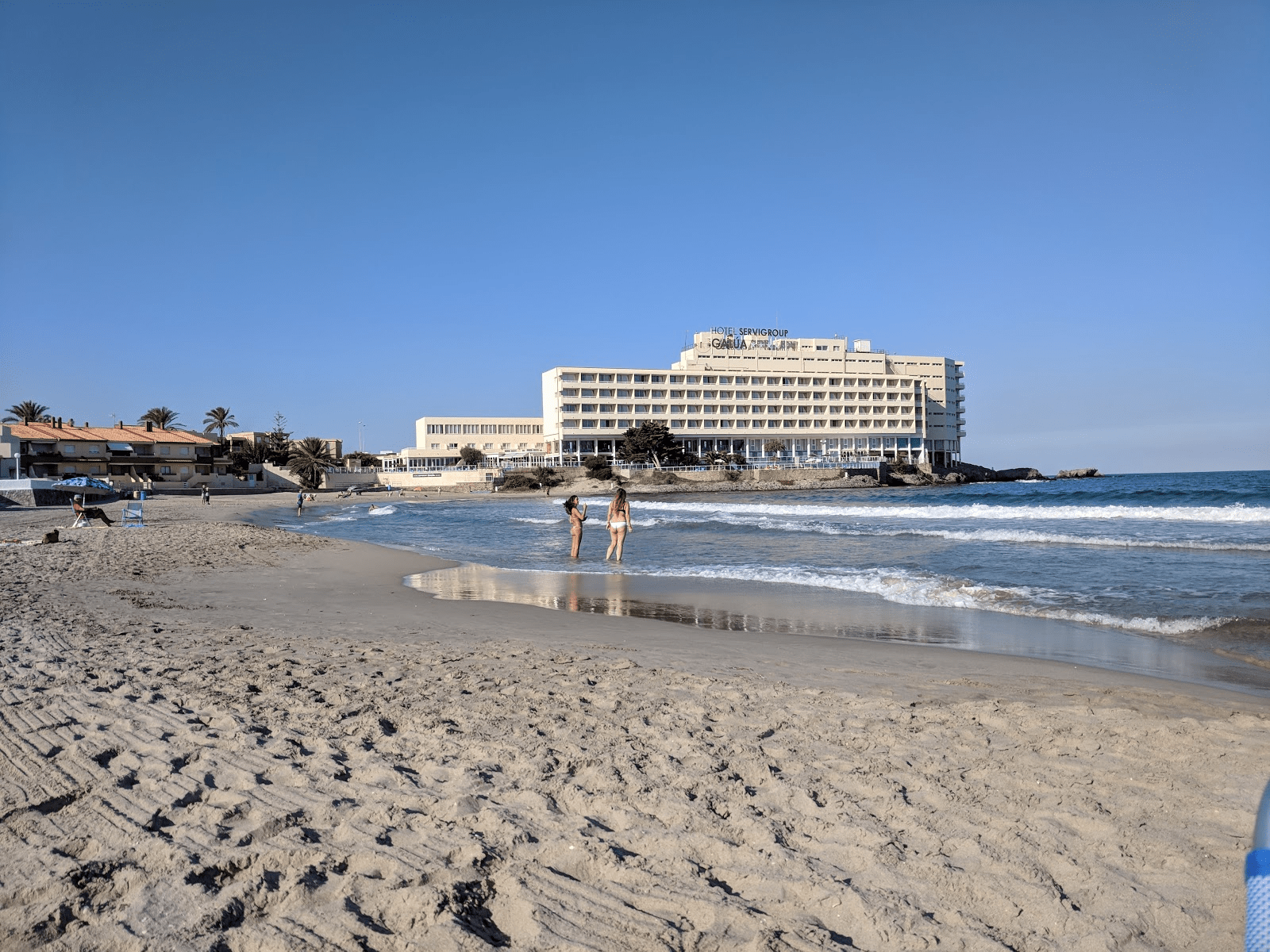 picture of Playa de Galua showing people walking on the sand
