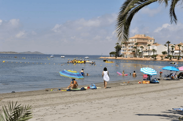 picture showing multiple people enjoying the beach in Playa del Vivero