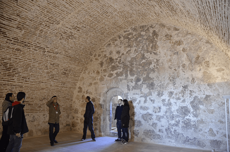 picture of a group doing a guided tour inside the castle