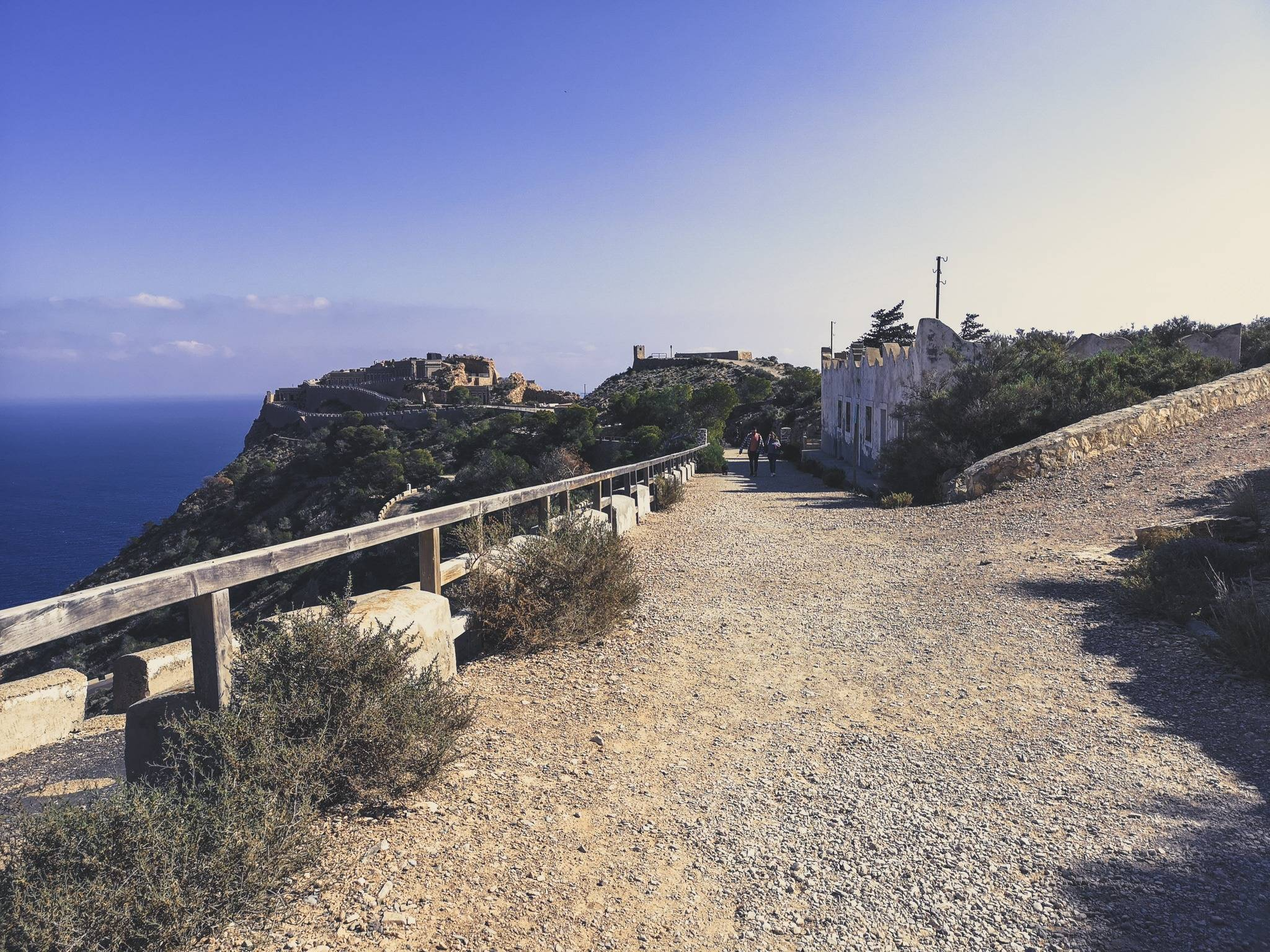 picture of tourists walking through the area of the fortress