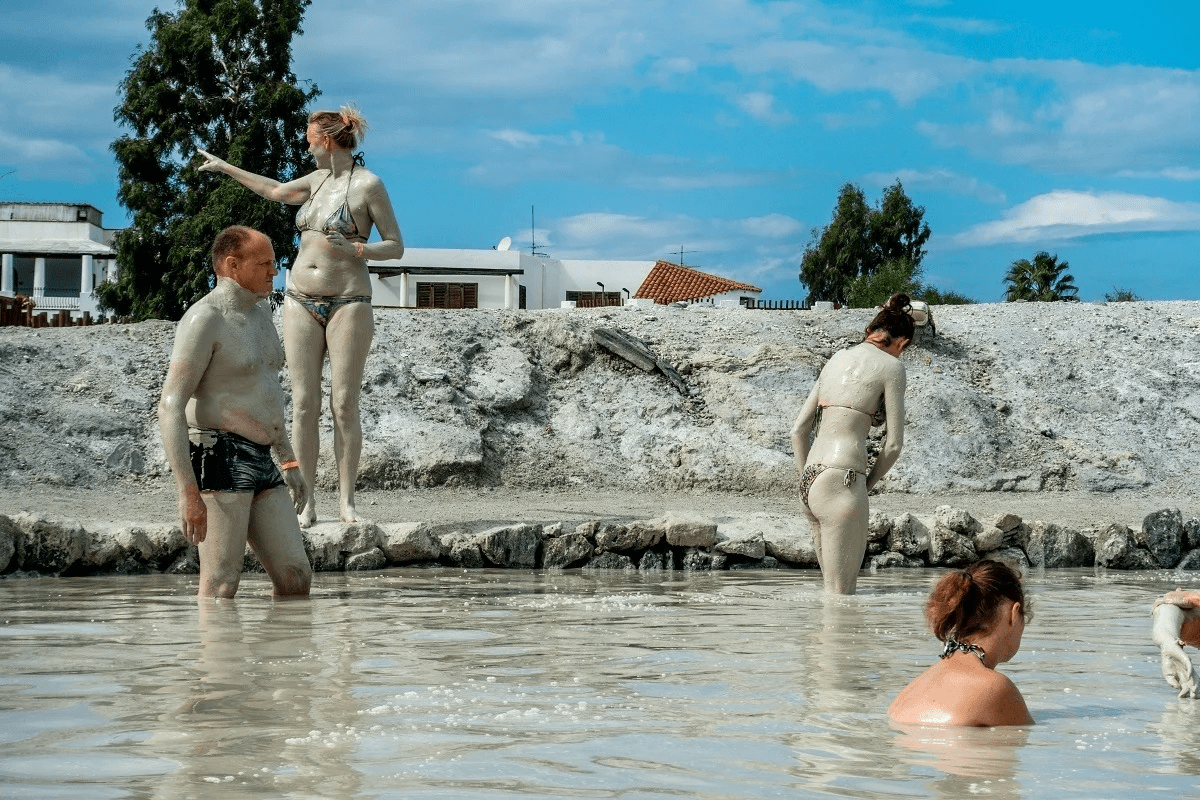 image of a group mud bathing