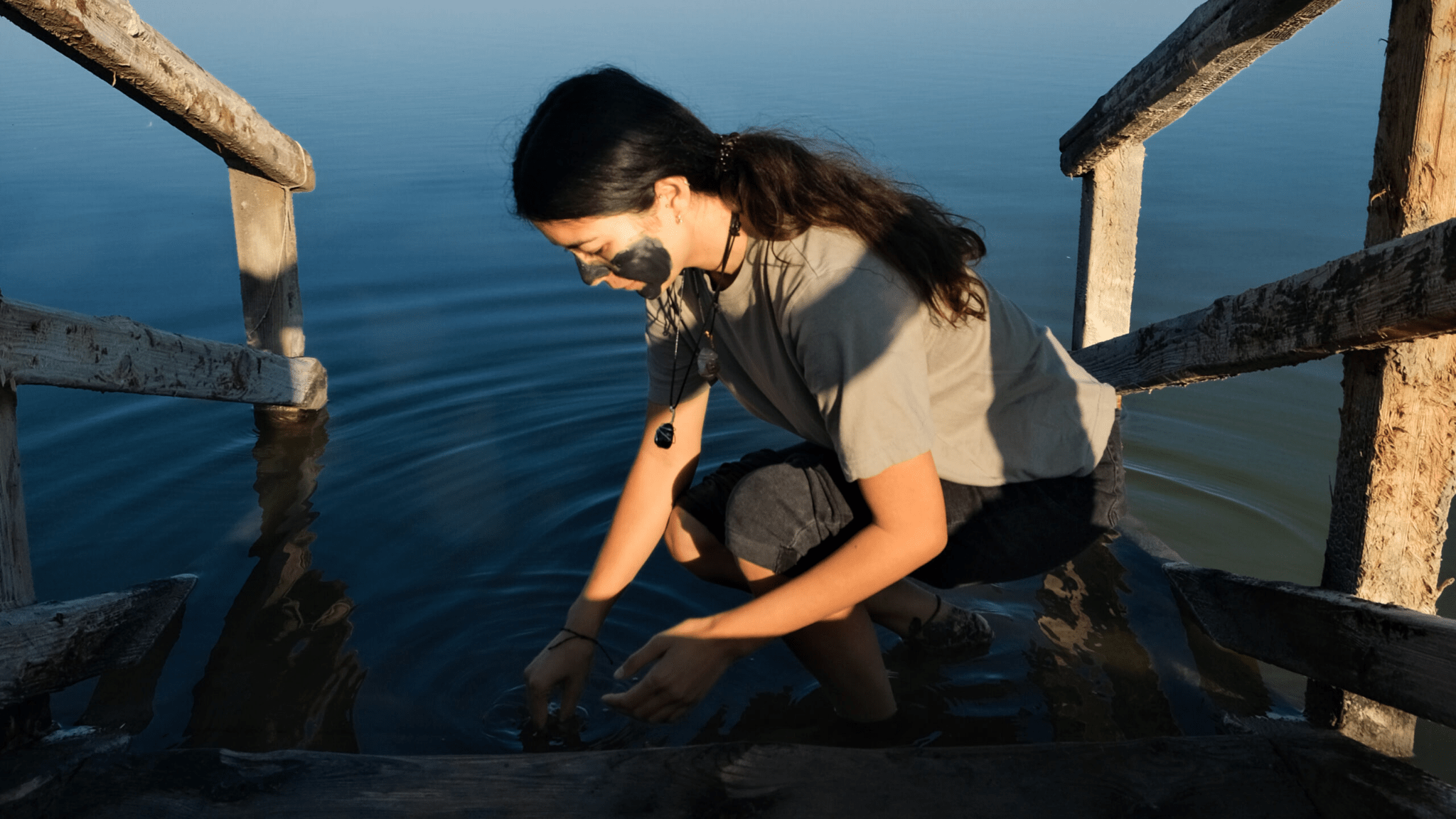 image of a person applying mud to their skin