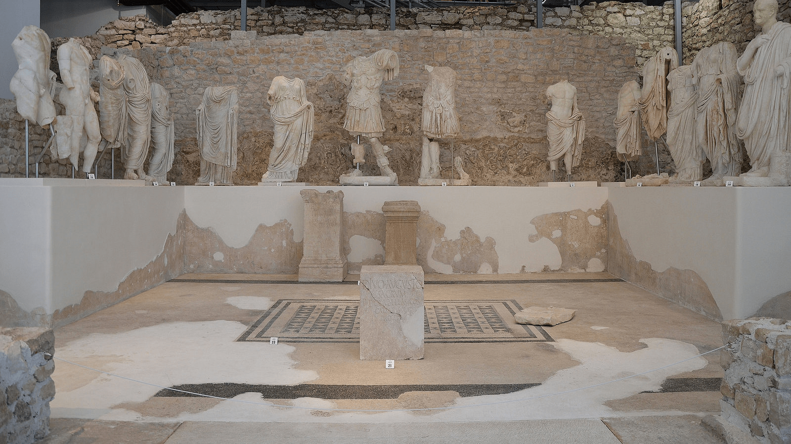 picture of one of the exhibitions from the museum showing multiple statues