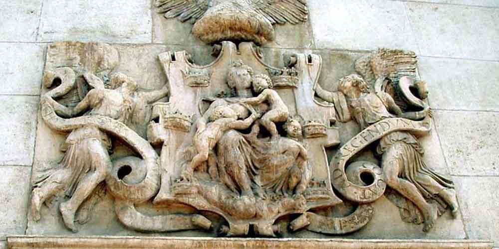 The relief of the Matrona of Murcia in the facade of the Almudí Palace
